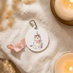 Celebration Keychain photographed flat from above on linen