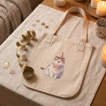 Celebration Tote Bag photographed flat from above on linen
