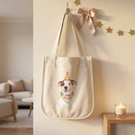 Celebration Tote Bag hanging from a hook on the wall