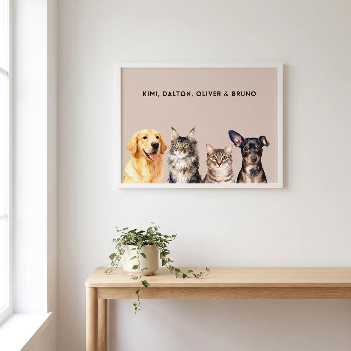 Custom Watercolor Four Pet Portrait hanging on the wall above a console table