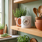 Custom Herb Wreath Mug on a shelf beside a plant