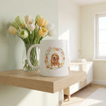Custom Tulip Wreath Mug on a shelf beside a plant