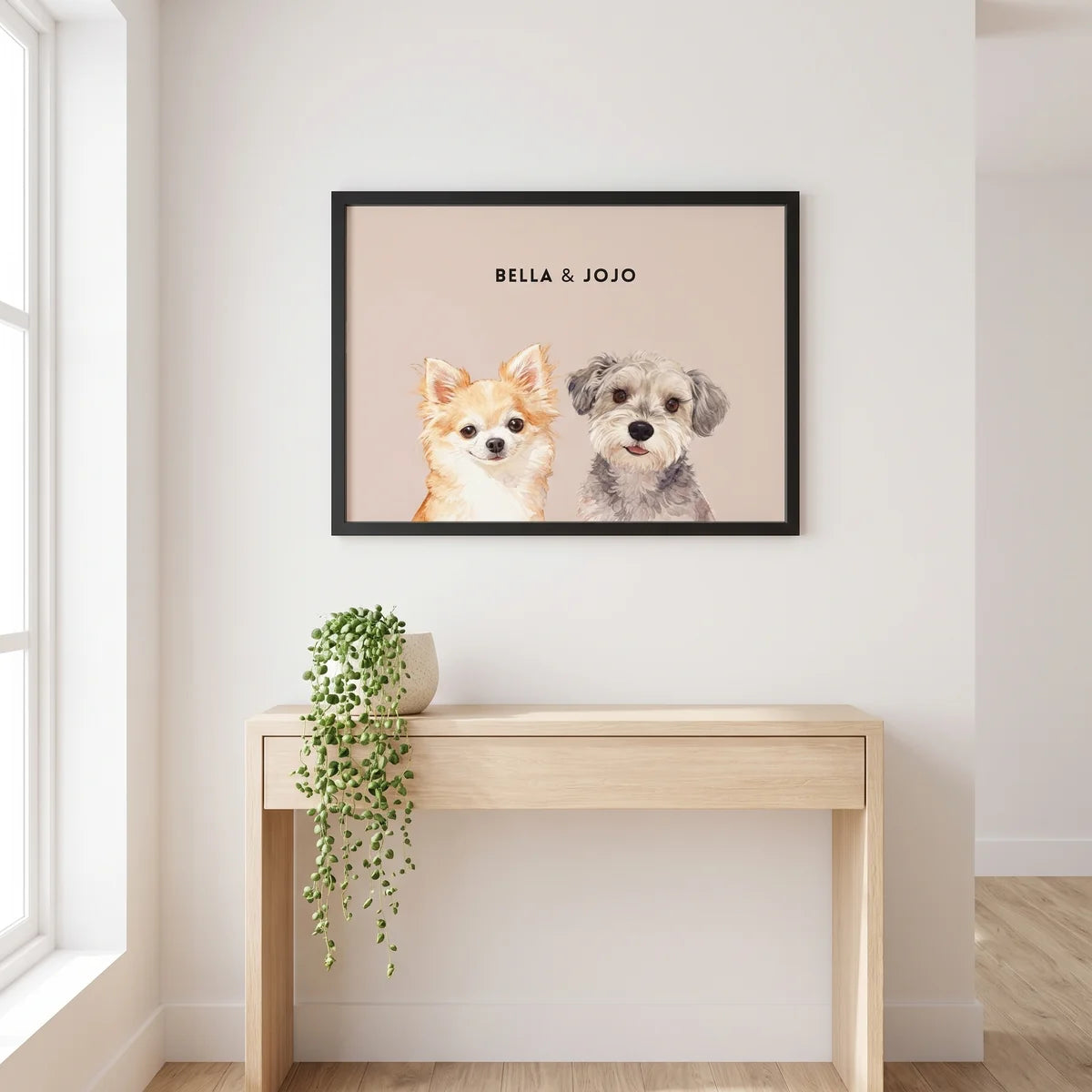 Custom Watercolor Two Pet Portrait hanging on the wall above a console table