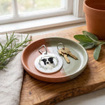 Herb Wreath Keychain in an entryway tray beside a set of keys