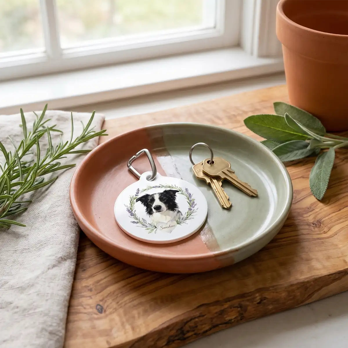 Herb Wreath Keychain in an entryway tray beside a set of keys