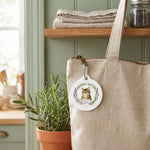 Herb Wreath Keychain clipped to a bag