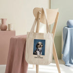 High School Photo Pet Tote Bag. The natural canvas tote bag slung over the back of a pale wooden chair in a bright minimal room.