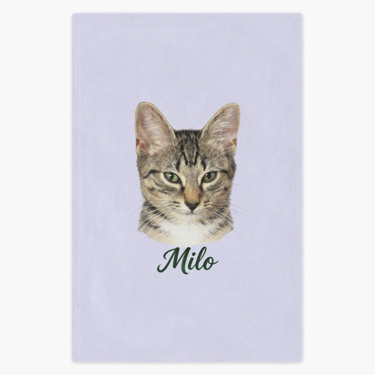Colored pencil portrait of a tabby cat printed on a lavender fleece blanket, with the name "Milo" drawn below.