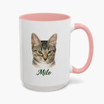 Colored pencil portrait of a tabby cat on a 15 oz mug with a pink handle, with the name "Milo" drawn below.