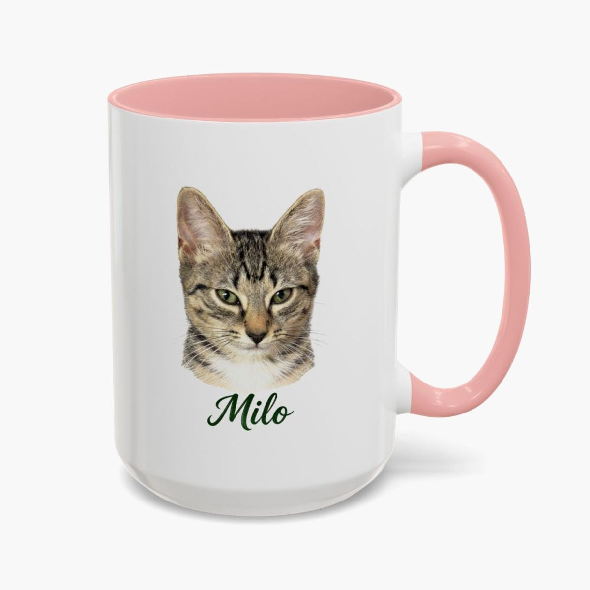 Colored pencil portrait of a tabby cat on a 15 oz mug with a pink handle, with the name "Milo" drawn below.